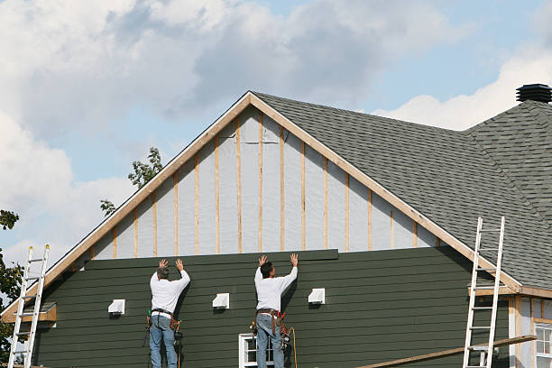Professional Siding Replacement technician working in Paoli, IN